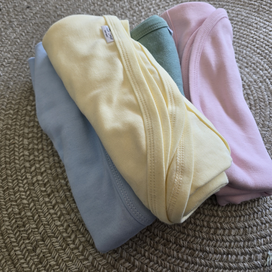 100_cotton_swaddle_blankets yellow, sage, blue and pink
