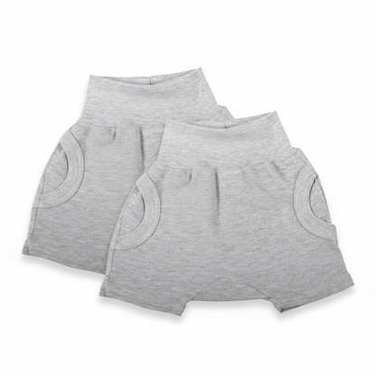 Two pairs of gray shorts on a white background