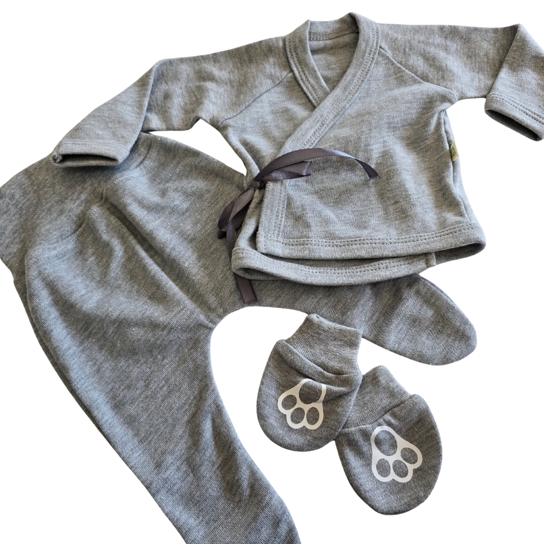 Gray baby outfit with onesie, shirt, and mittens on a white background