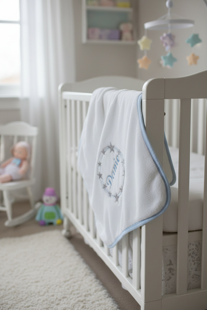 Baby blanket with 'Danie' embroidered on a plain background