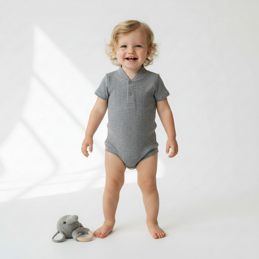 Toddler wearing the tab onesie