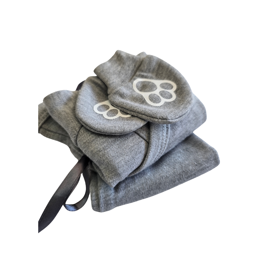 Gray baby booties with paw print design on a white background