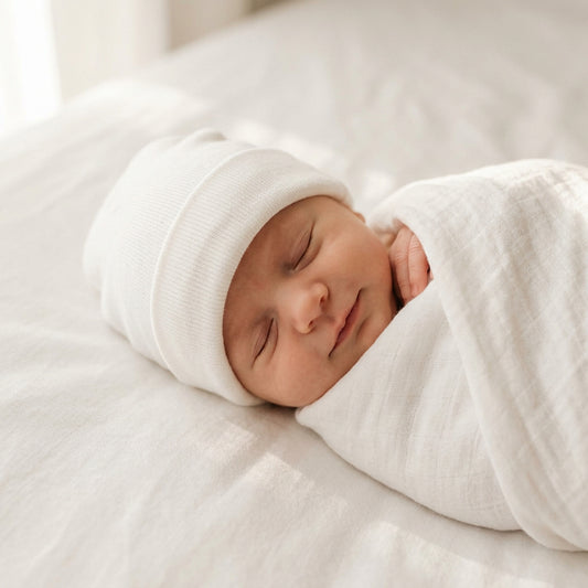 Baby wearing White-Beanie- Little Lumps